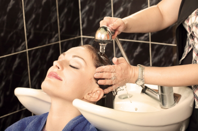 woman receiving hair shampoo